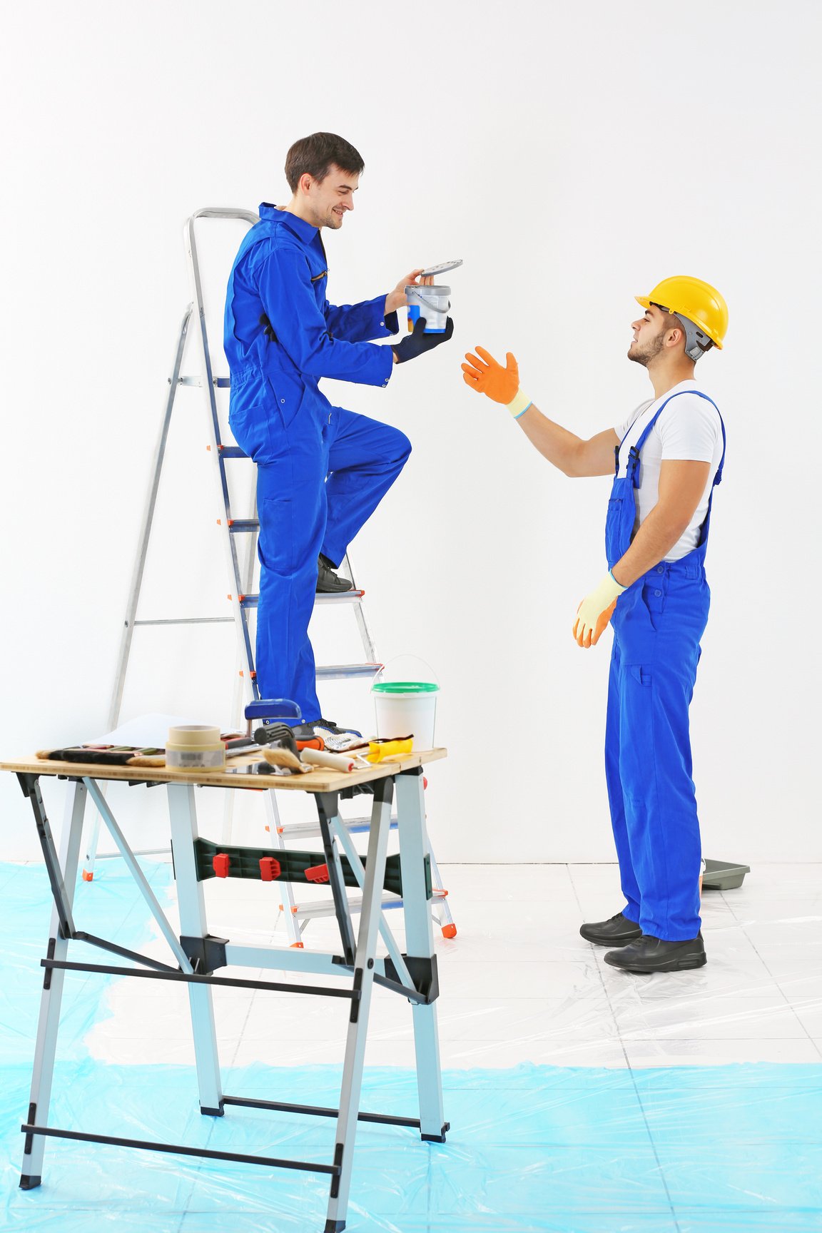 Workers Repainting Room